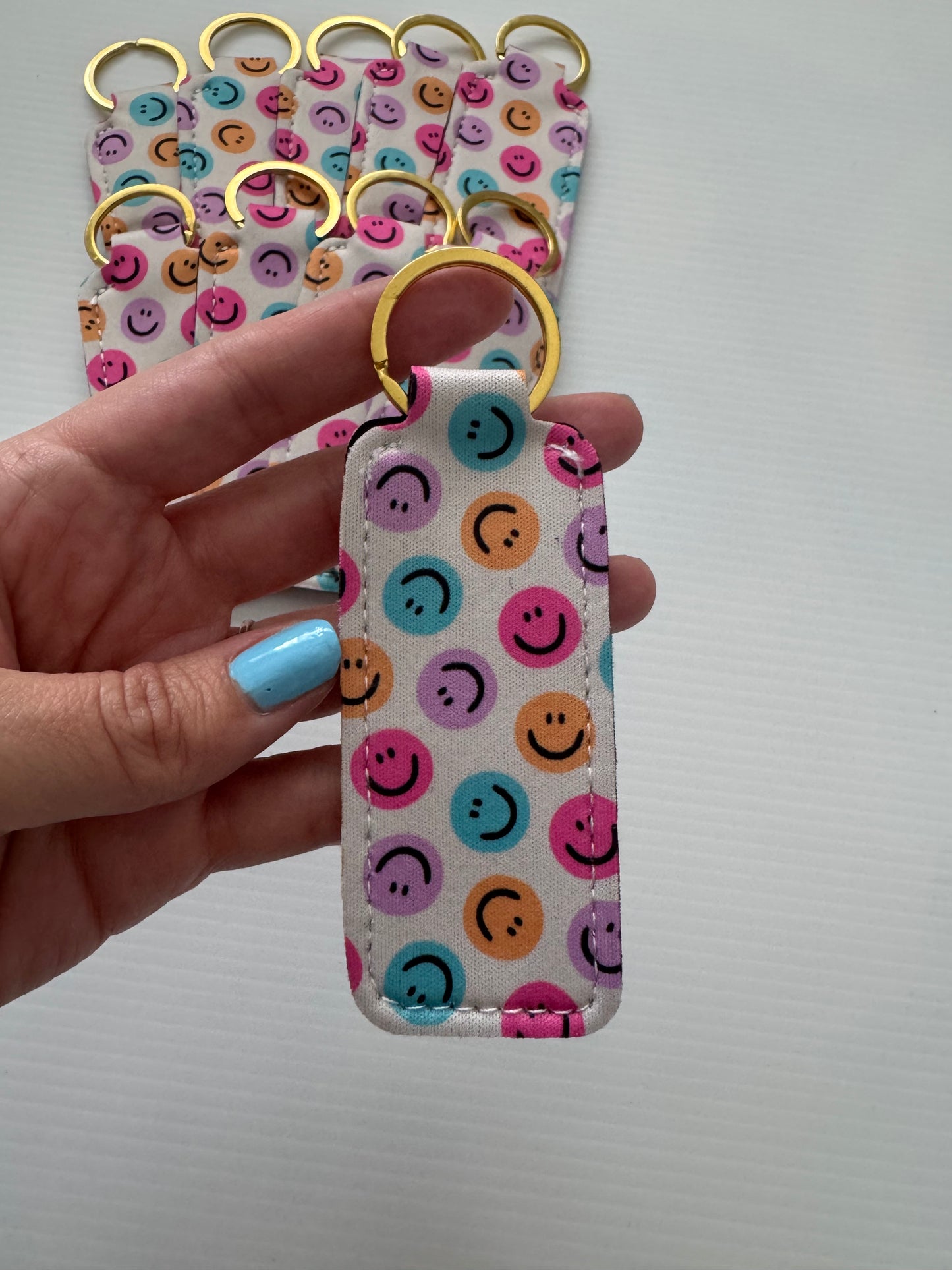 White Happy Faces Chapstick Holder Keychains (Pack of 5)